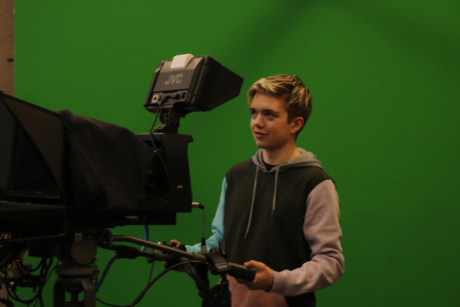 Zach using a camera in the CHTV studio