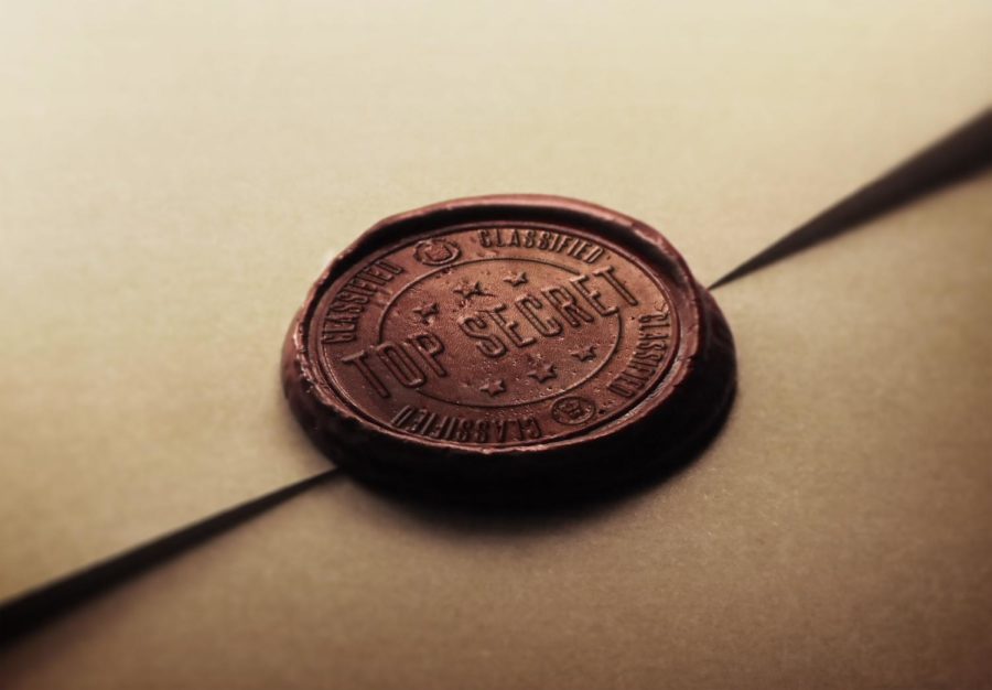 A stamp on an folded piece of paper that says, Top secret