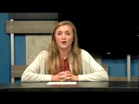Olivia Freight sitting at the news desk