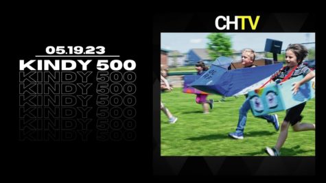 The text, KINDY 500 with an image of kids running in the grass wearing boxes