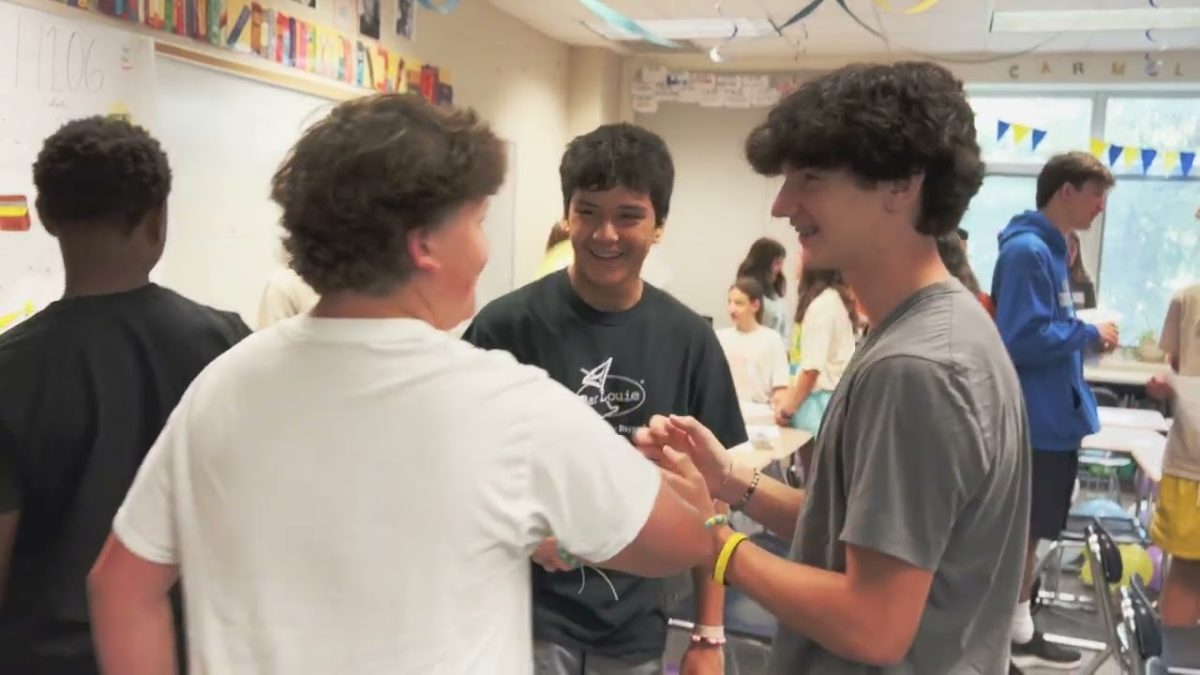 Students talking to each other in a classroom at Carmels Greyhound Kickoff event