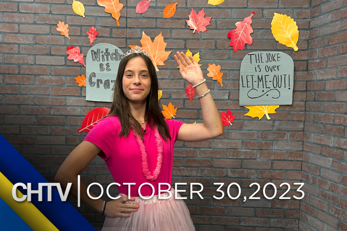 Brenna standing at the sports set while waving at the camera while dressed as a princess, with the text CHTV: October 30, 2023 in front of her