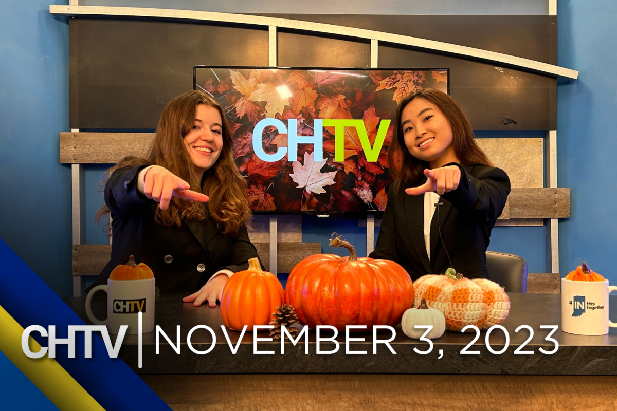 Gigi and Rebecca sitting at the news desk while pointing at the camera, with the text, CHTV: November 3, 2023 in front of them