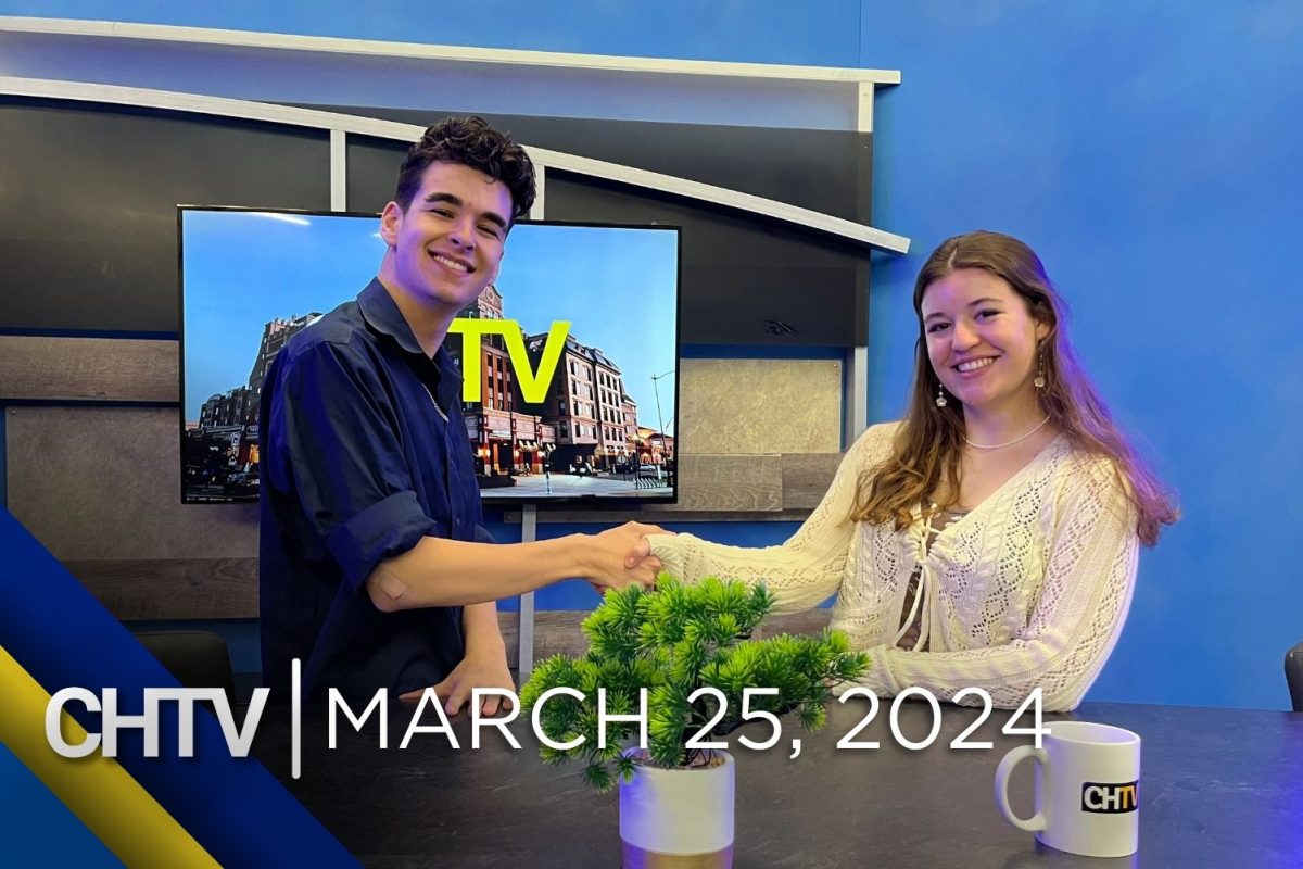 Cole and Gigi shaking hands while standing at the news desk with the text, CHTV: March 25, 2024 in front of them
