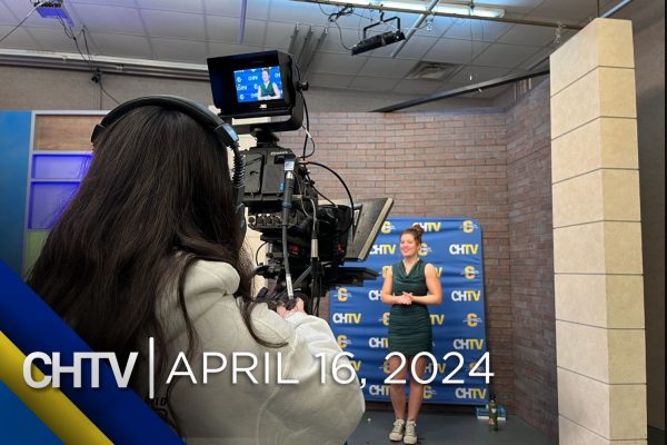 A camera pointed at Gigi who is standing in front of the sports set. In front of the image is the text, CHTV: April 16, 2024