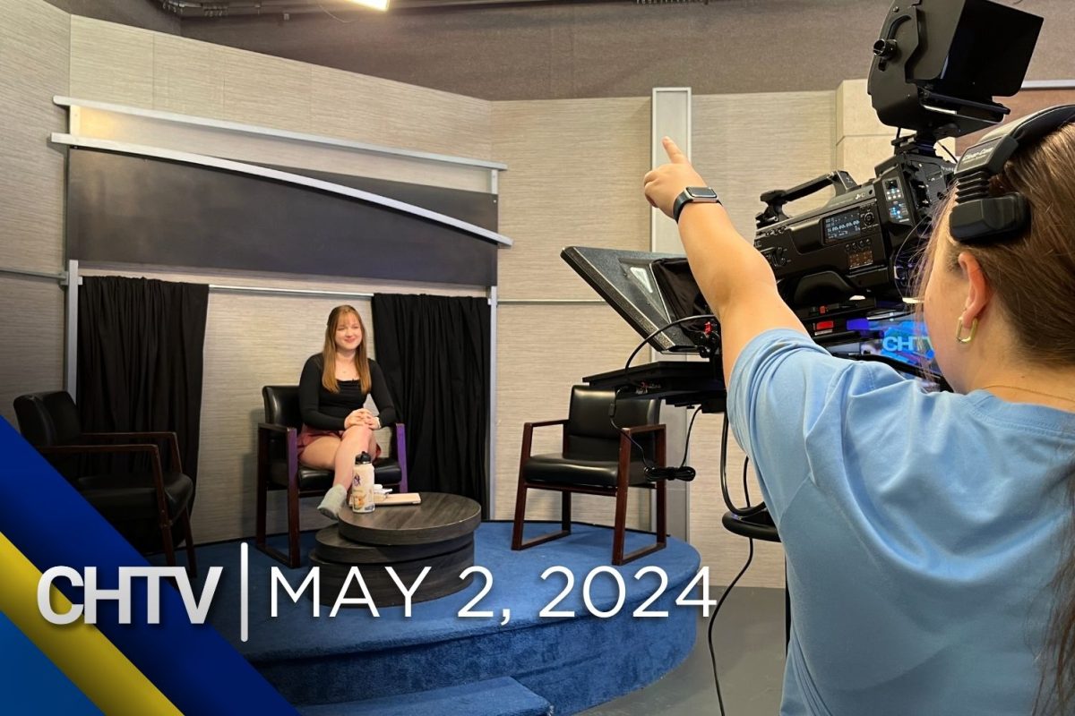 A camera pointed at Selah who is standing in front of the entertainment set. In front of the image is the text, CHTV: May 2, 2024