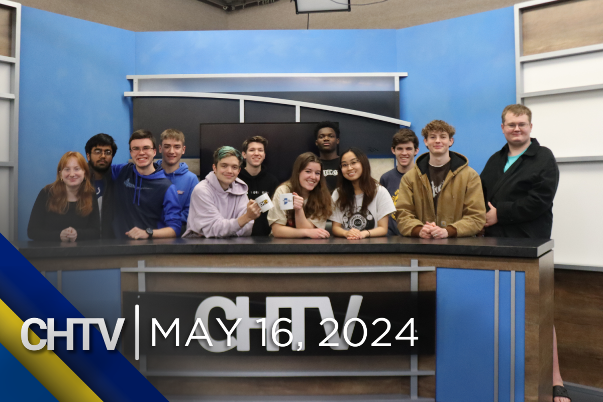 The CHTV 2024 seniors standing around the news desk with the text, CHTV: May 14, 2024 in front of them