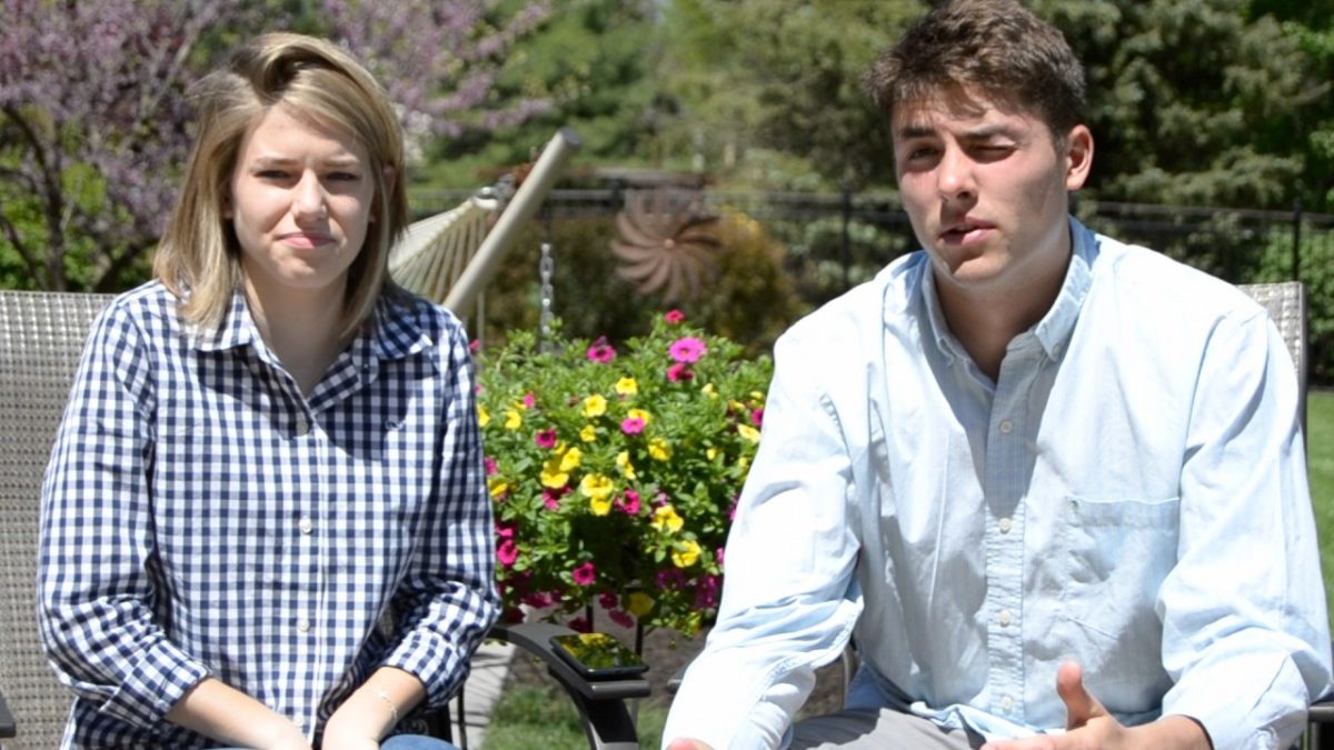 Mike Petz and Georgia Simmons sitting outside